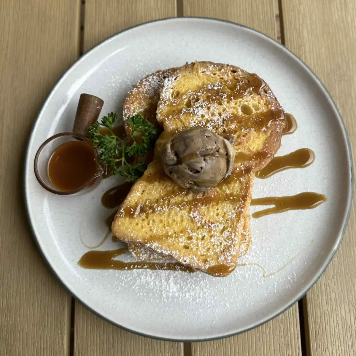 Caramel french toast on thick sourdough, glossy with sauce, at Thongyib Thongyod