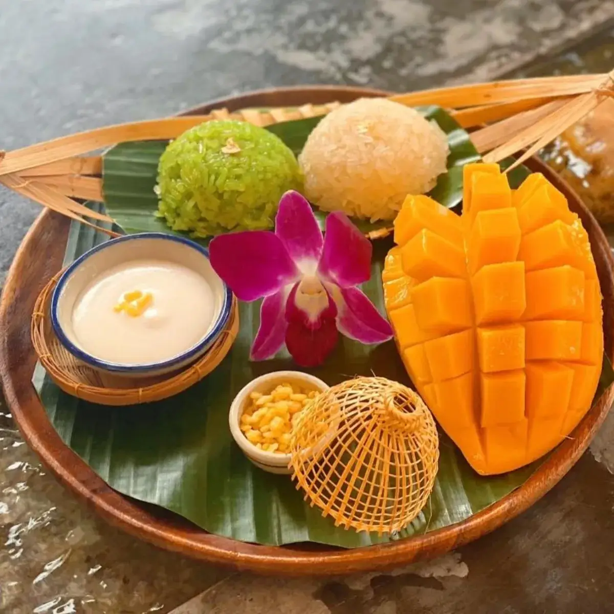 Mango sticky rice — ripe mango slices with coconut sticky rice — the cafe's most-mentioned dish