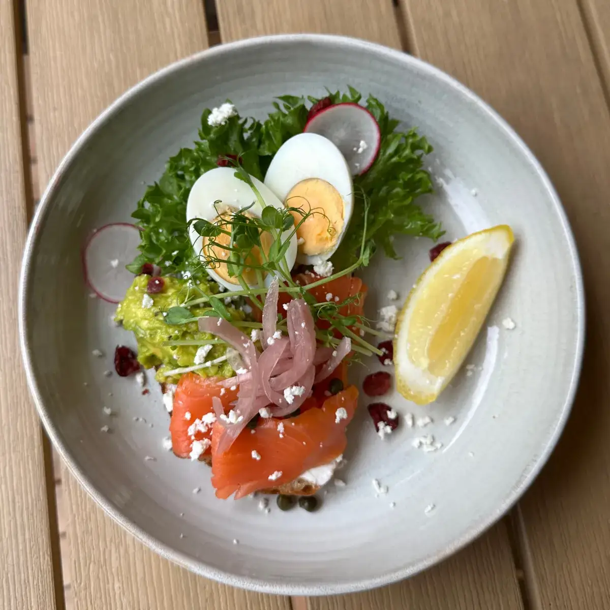 Smoked salmon and avocado layered on a thick slice of sourdough toast