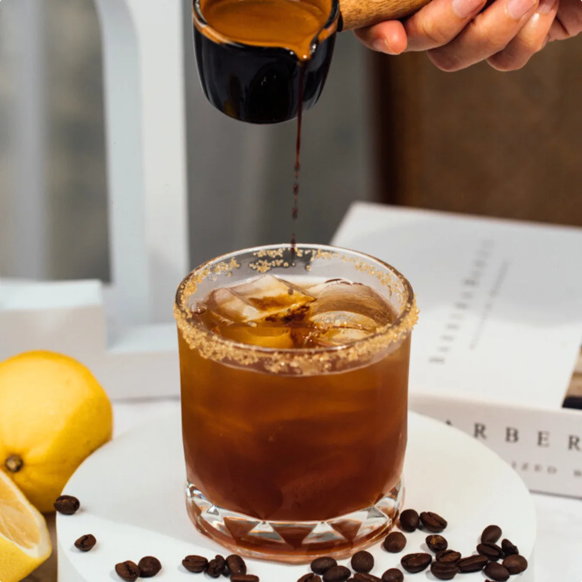 Secret N.9 — a layered iced espresso drink with lemon and mint in a tall glass